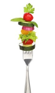 Mixed vegetables on a fork isolated. Diet concept