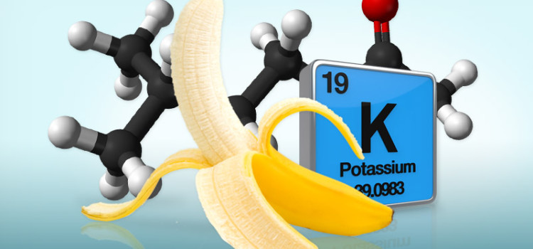 A partially peeled banana in front of the atomic table symbol for potassium and a molecule model behind it all.