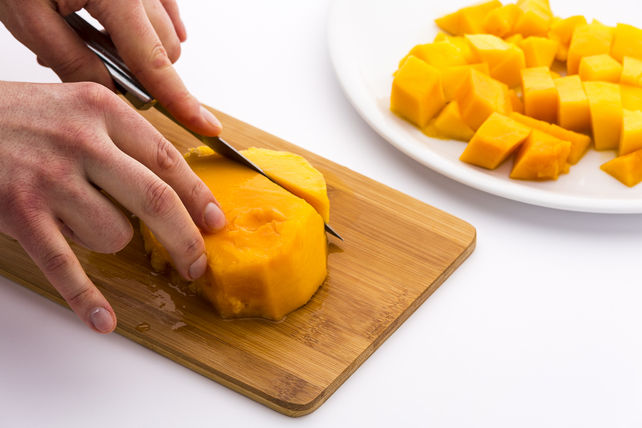 A mango almost completely cut up