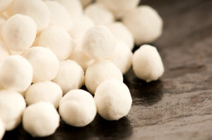 Tapioca flour pearls on a dark table surface