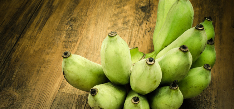 Bunch of Green banana on wooden table