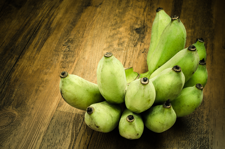 Bunch of Green banana on wooden table